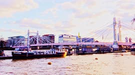 A West Side View Of The Albert Bridge From The Embankment At Sunset