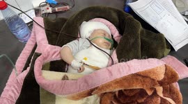 Baby rescued from wreck after being injured in Israeli attack in Gaza