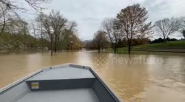 Police use boats to navigate flooded streets in Kentucky