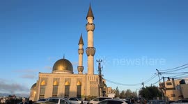 Palestinians in West Bank city of Ramallah perform Eid al-Fitr prayer