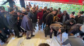 Palestinians bid tearful farewell to relatives killed in Israeli attack on Al-Farra family's house in southern Gaza