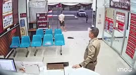 Policeman collapses from heat exhaustion at station as warmer weather arrives in Thailand