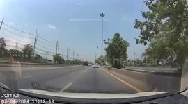 Loose tyre bounces across road in front of traffic