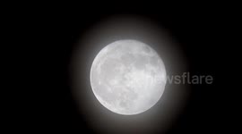 The April Full Moon, known as the Pink Moon high in the sky over East London