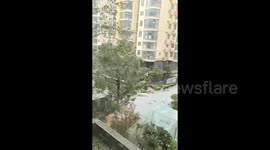 Girl knocked over by flying metal sheet as rare, extreme winds hit northern China