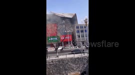 Shopping mall roof lands on another building after being ripped off by extreme winds in China