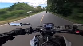 High-speed motorcycle overtakes riders in Palmar Norte, Costa Rica
