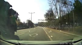 Pedestrian crossing with bicycle narrowly avoids truck in Jilin, China