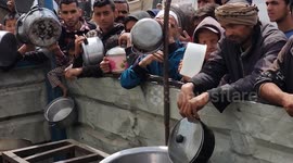 Desperate Palestinians queue for food in Gaza as hunger crisis worsens