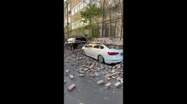 Wall collapses onto parked vehicles after strong wind in Hebei, China