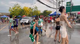 Bar runs out of water and uses beer to splash revellers during Thailand's Songkran festival