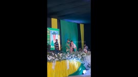 Schoolboy tumbles down steps while receiving school excellence award