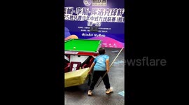 Five-year-old billiards player competing in tournament uses booster pad to reach table