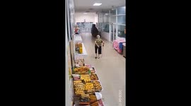 Shop wall collapses onto grandmother in Bangkok