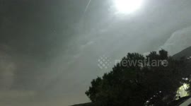 Meteor illuminates night sky over Balearic Sea in Spain