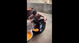 Chef cooks perfect egg sheets using giant wok