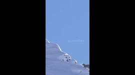 SNOW  LEOPARD summits 16,000 foot peak.