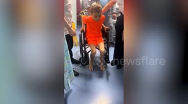 Boy takes first steps after emergency brain surgery following road traffic accident