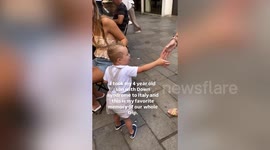 Cute moment boy with Down syndrome pretends to be barista for his sisters