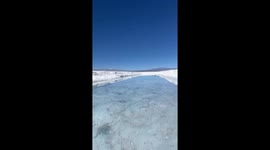 Man records girlfriend's failed attempt at jumping over salt flat puddle