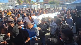 Palestinians bid tearful farewell to relatives killed in Israeli attack on central Gaza Strip