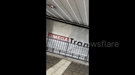 Semi-truck squeezes under low overpass as driver powers through