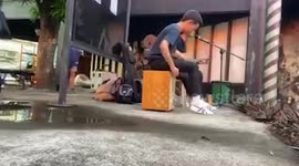 Thief steals youngster's backpack while he busks with guitar
