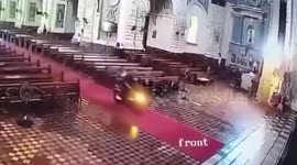 Worshipper rides into church on a MOTORBIKE to reach altar and pray