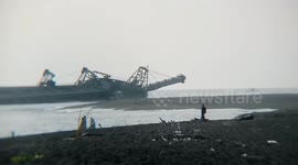 Chinese crewman killed and 10 missing as sand carrier capsizes