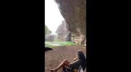 Sheltering under a rock during a rainstorm at Balloch’s Cottages campsite
