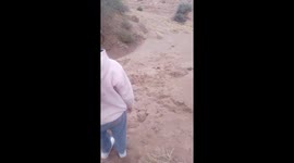 Two Kids Tumble Downhill