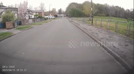 Masked illegal electric bike rider pulls a wheelie on the road