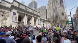 Anti-Trump demonstrators gather outside New York Public Library as protest kicks off