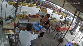 Spooked stray cow causes carnage as it tries to leap fruit stall