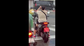 Tourist takes selfie on motorcycle... before riding into traffic and crashing