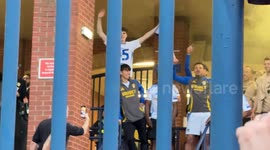 Leeds United Fans Celebrate Premier League Promotion at Elland Road Stadium with the Footballers