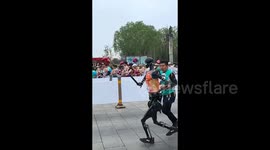 China hosts first-ever humans vs robots half-marathon - watch highlights here