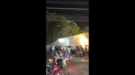 Locals carry entire marquee as rain hits Easter gathering