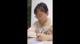 Cat nibbles hand while user studies in Ningxia, China