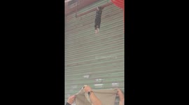 People rescue cat hanging from above in Sichuan, China