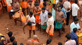 Hooked on faith: Devotees hang from cranes and pull tracks with pierced backs in painful Hindu festival