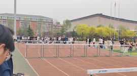 Chinese 100m hurdle race descends into chaos with students pushing over fences