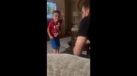 Dad gets a surprise slap from his toddler during playful game