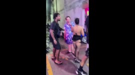 Tourist ushered away by bouncers during argument with sex bar worker