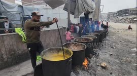 Gaza Strip, Palestine: Palestinian children line up for a free meal