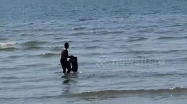 Plane crash victims pulled from the sea in front of luxury hotel in Thailand