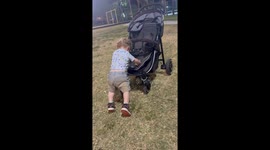 Baby uses stroller to practice walking