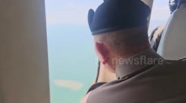Police helicopters scour scene of plane crash on Thai beach