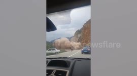 Massive landslide sends up huge cloud of debris and dust