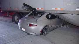 US, Los Angeles: Pomona Driver Trapped After Crashing Under Semi Trailer